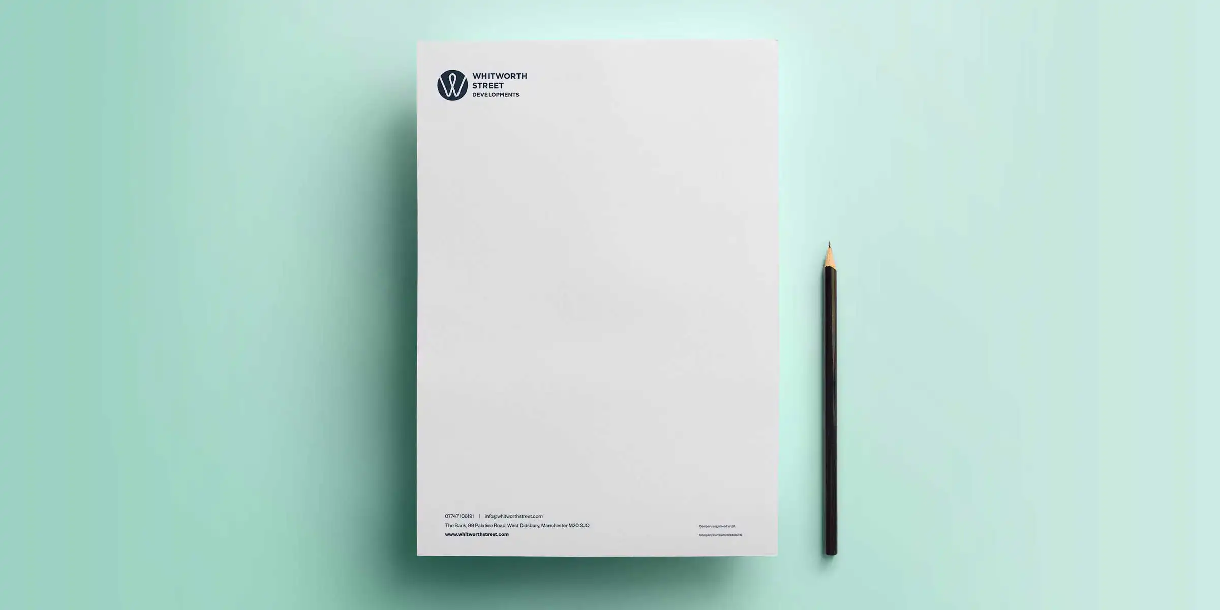 mock up of a letterhead on a mint coloured background